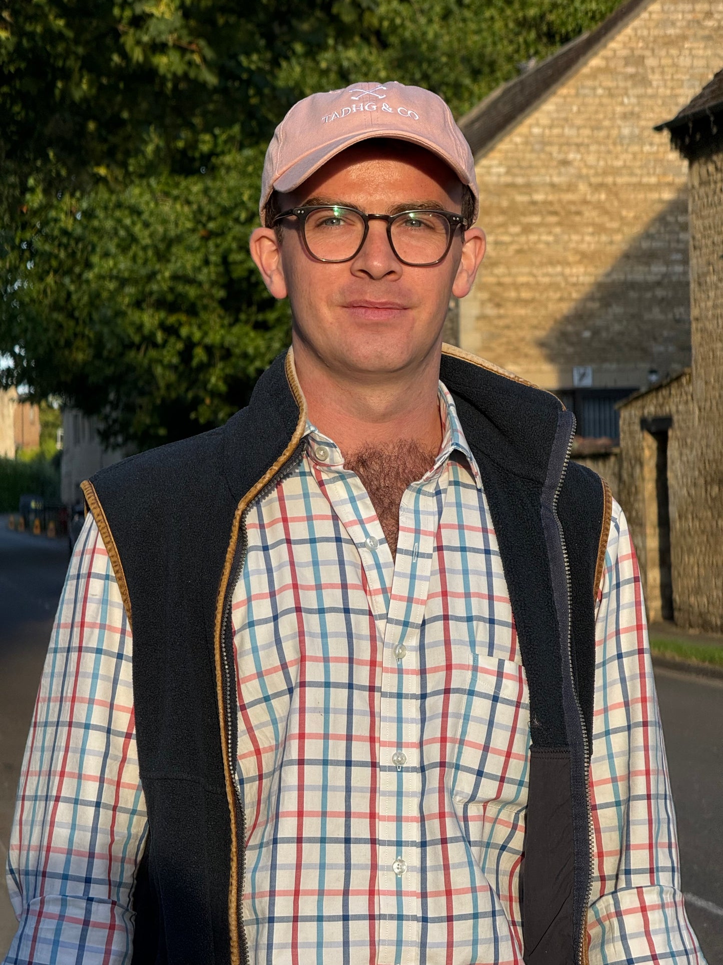 Man wearing Tadhg & Co peach cap made from premium materials, designed for everyday wear with a classic British country aesthetic.