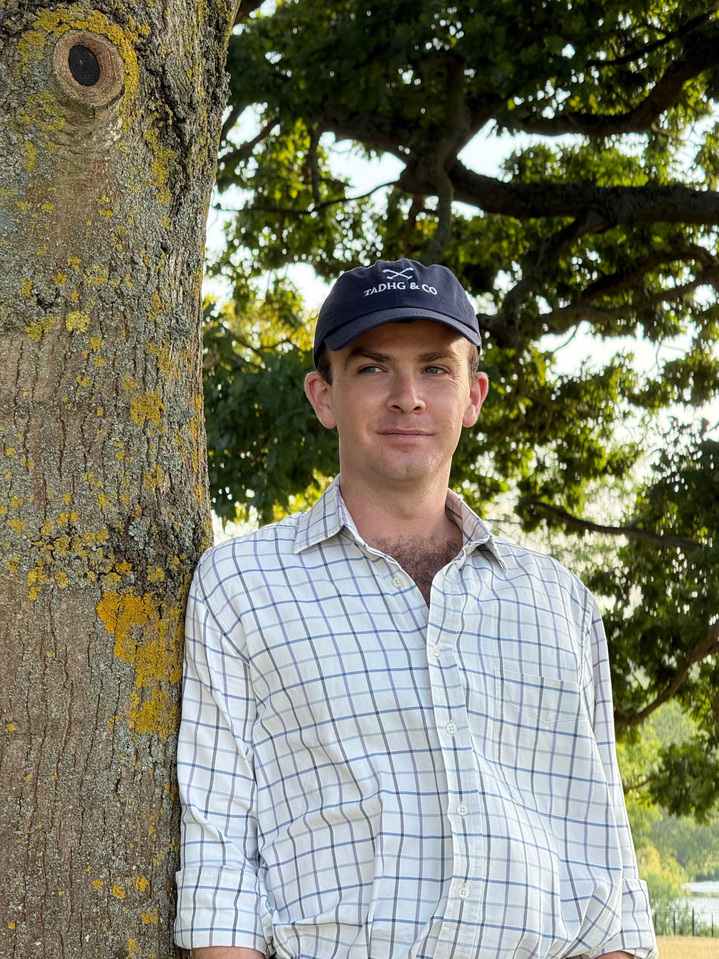 Man wearing Tadhg & Co Navy blue cap made from premium materials, designed for everyday wear with a classic British country aesthetic.